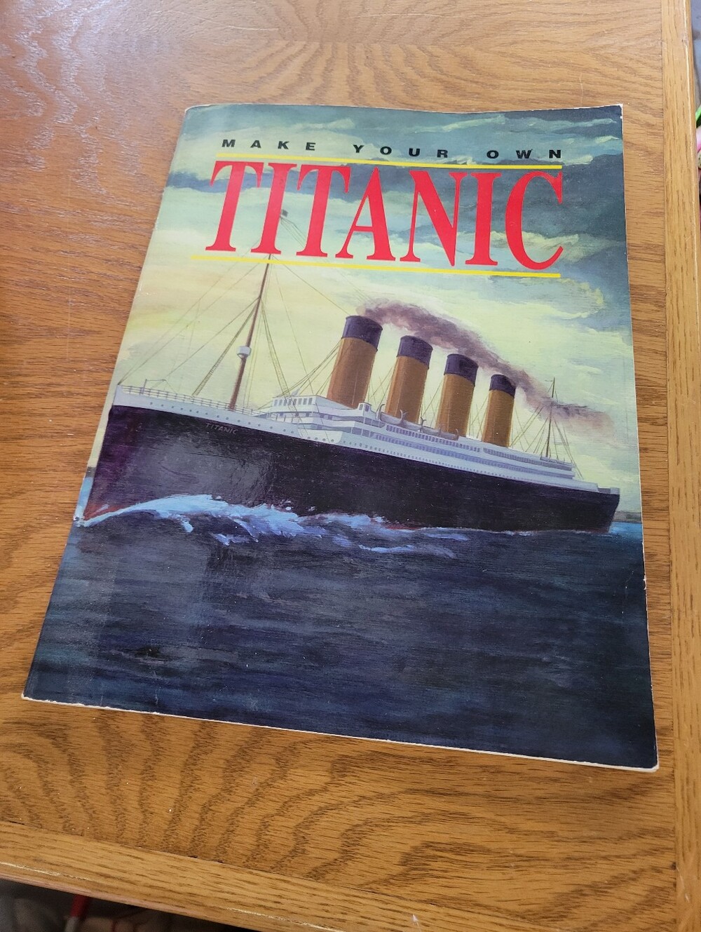 Titan by Titan — Navy, Gold and Red Illustrated Model Book Cover